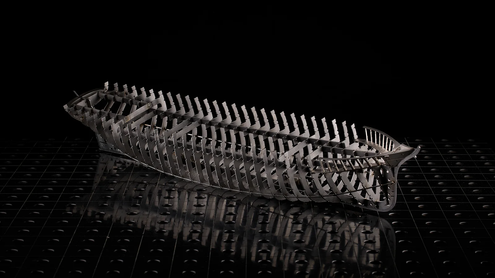 Complex sculptural fish assembled from many accurately cut metal profiles