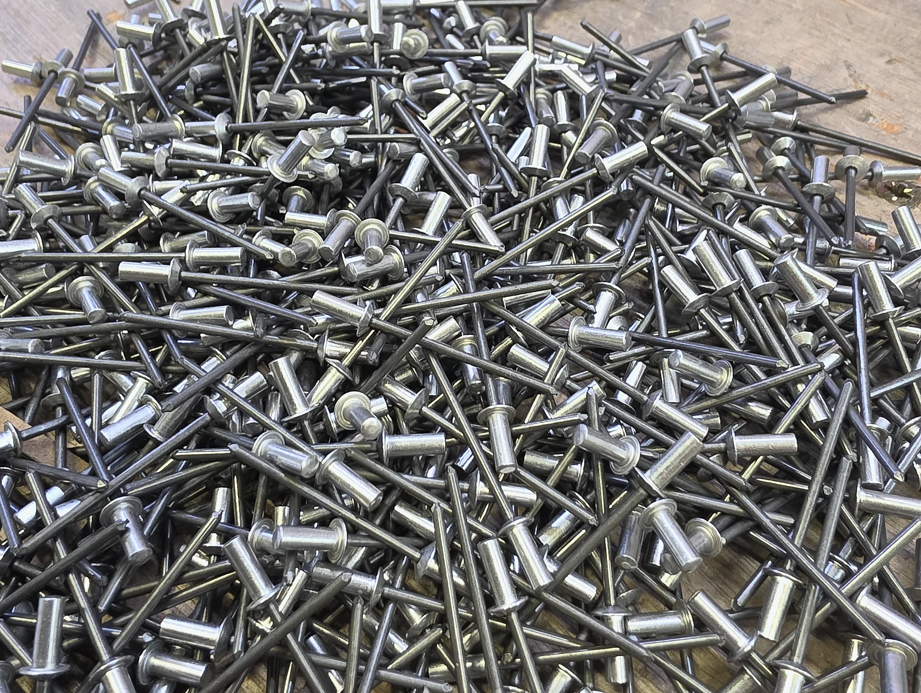 Blind rivets prepared for fitting into a sheet-metal assembly
