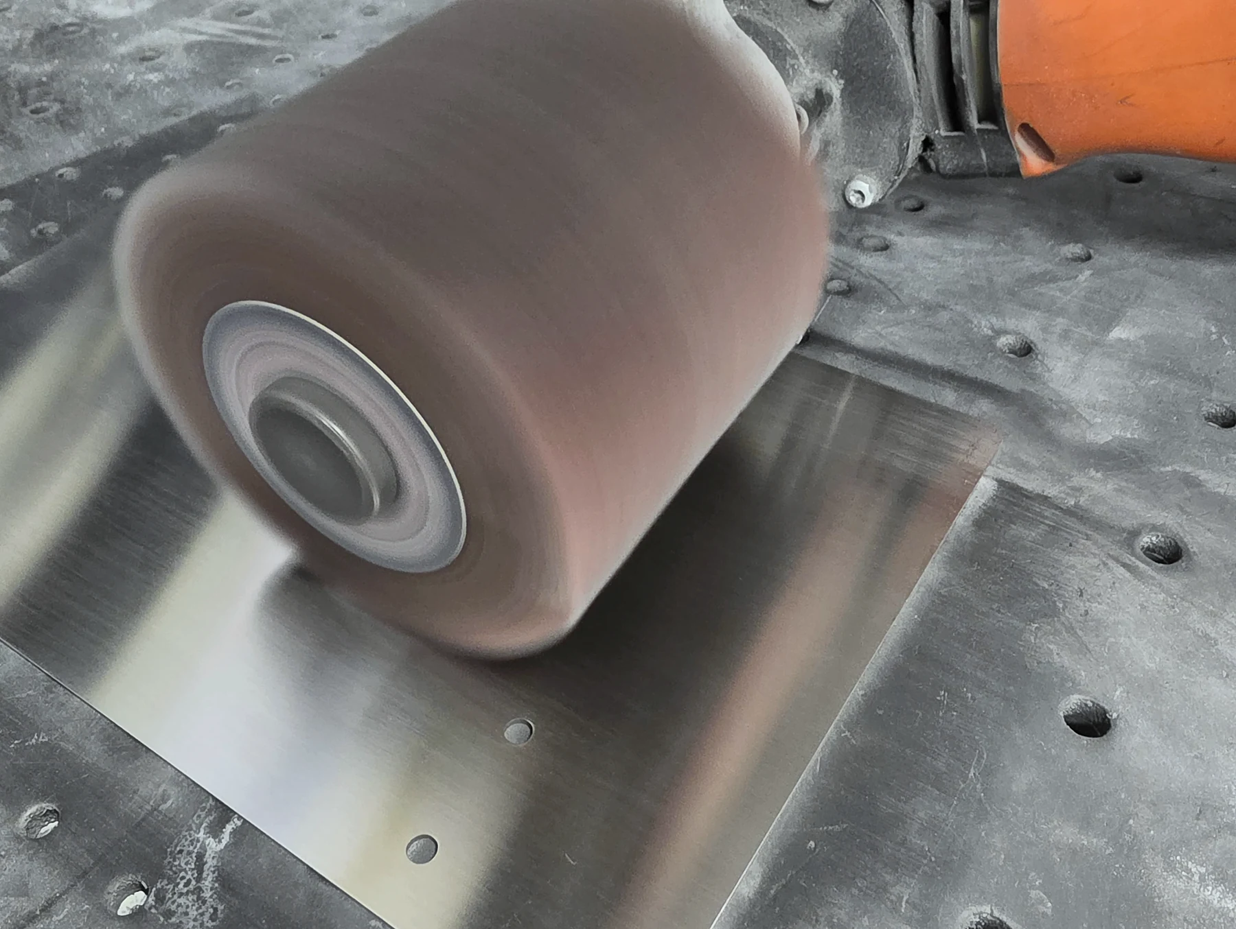 A first-off sheet-metal part being refined at the bench