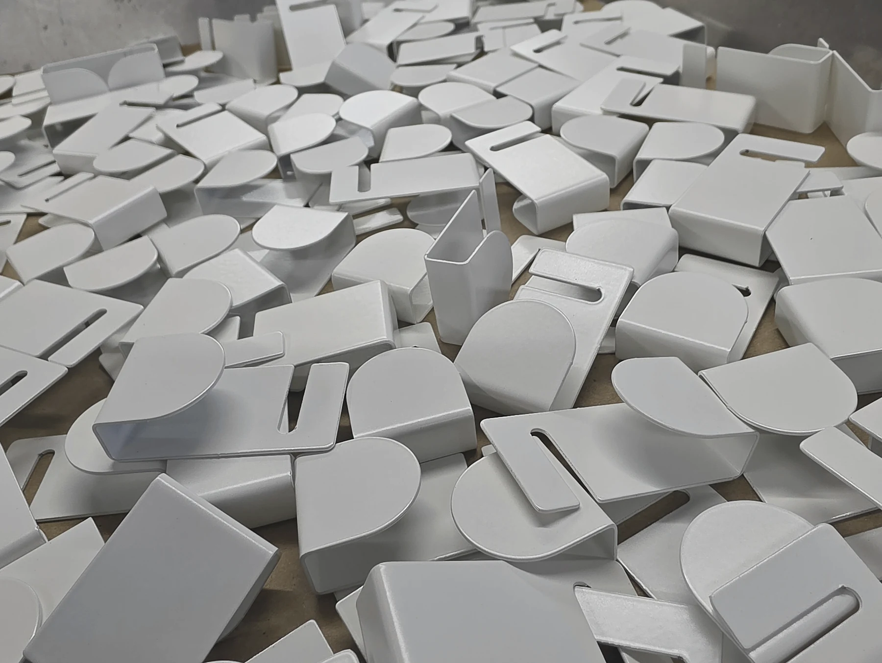A group of finished powder-coated fabricated components