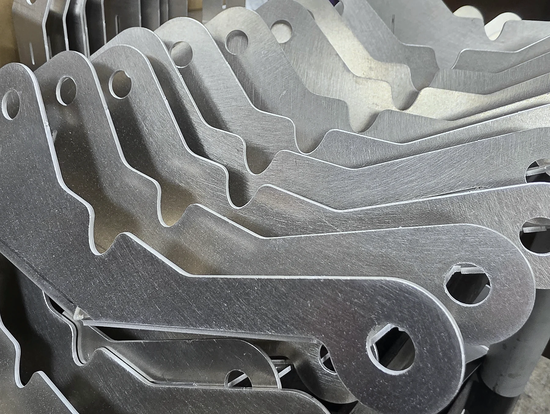 A varied set of precision laser-cut sheet-metal parts