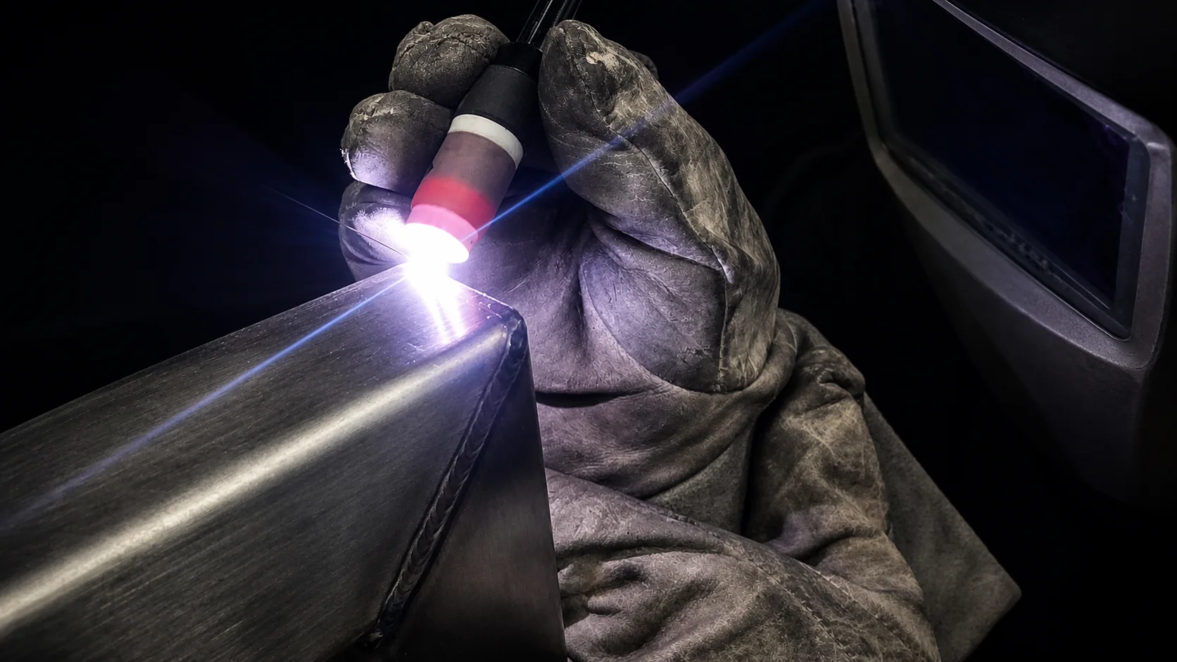 Close-up of TIG welding a fabricated sheet-metal component